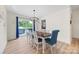 Cozy dining room with a wood table, cushioned chairs, and modern light fixture at 1009 Rainbow Cir, Catawba, SC 29704