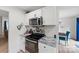 Updated kitchen featuring stainless steel oven, microwave, white cabinets, and granite countertops at 1009 Rainbow Cir, Catawba, SC 29704