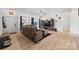 Open living room featuring wood floors, ample lighting, and a comfortable seating arrangement at 1009 Rainbow Cir, Catawba, SC 29704