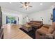 Open concept living and dining area with wood floors and plenty of natural light at 1009 Rainbow Cir, Catawba, SC 29704