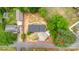 An aerial view shows a gray roof and a defined lot bordered by trees at 105 N Baldwin Ave, Kannapolis, NC 28083