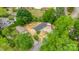 An aerial view shows a home with an enclosed yard, surrounded by trees and neighboring houses at 105 N Baldwin Ave, Kannapolis, NC 28083
