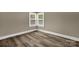 Bright bedroom featuring hardwood floors and a corner window that provides plenty of natural light at 105 N Baldwin Ave, Kannapolis, NC 28083