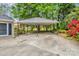 Convenient covered parking or carport located near the main house in a backyard setting at 105 N Baldwin Ave, Kannapolis, NC 28083