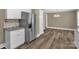 Kitchen and dining area featuring hardwood floors, stainless steel appliances, and white cabinets at 105 N Baldwin Ave, Kannapolis, NC 28083