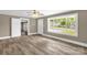 Bright living room with large window, ceiling fan and new wood flooring at 105 N Baldwin Ave, Kannapolis, NC 28083