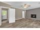 Spacious living area with new floors, a brick fireplace and natural light at 105 N Baldwin Ave, Kannapolis, NC 28083