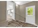 Stairway with views into the living room and kitchen area at 105 N Baldwin Ave, Kannapolis, NC 28083