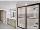 Modern bathroom features a double sink vanity, and shower with a glass sliding door at 11 Cobblestone Nw Ln, Concord, NC 28027