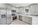 Bright kitchen with stainless steel appliances, quartz countertops, and mosaic tile backsplash at 11 Cobblestone Nw Ln, Concord, NC 28027
