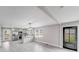 Open floorplan with a breakfast bar looking into a modern kitchen with stainless steel appliances at 11 Cobblestone Nw Ln, Concord, NC 28027