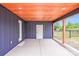 Covered patio with stained wood ceiling, accent beams, and view of fenced backyard at 11 Cobblestone Nw Ln, Concord, NC 28027
