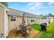 Cozy backyard patio with outdoor seating and a grill, perfect for enjoying the outdoors at 117 S Canyon Ridge S Dr, Mount Holly, NC 28120
