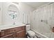 Neutral bathroom with a brown vanity, white countertops, and a shower with a white curtain at 117 S Canyon Ridge S Dr, Mount Holly, NC 28120