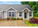 Charming single-story home with a well-manicured lawn and inviting facade at 117 S Canyon Ridge S Dr, Mount Holly, NC 28120