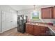 Practical kitchen area features modern appliances and durable floors at 117 S Canyon Ridge S Dr, Mount Holly, NC 28120
