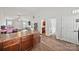View of the kitchen with hardwood floors, connecting to the living area at 117 S Canyon Ridge S Dr, Mount Holly, NC 28120