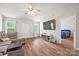 Cozy living room featuring hardwood floors, vaulted ceiling and natural light at 117 S Canyon Ridge S Dr, Mount Holly, NC 28120