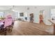 Bright living room with wood-look flooring, neutral walls, and open doorway to other rooms at 117 S Canyon Ridge S Dr, Mount Holly, NC 28120