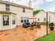 A shot of the home's backyard and patio area, with outdoor furniture and lawn at 11719 Withers Mill Dr, Charlotte, NC 28278