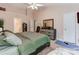 Spacious bedroom with a ceiling fan, and an ensuite bathroom for added privacy and convenience at 11719 Withers Mill Dr, Charlotte, NC 28278