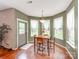 Bright breakfast nook with a view to a well-manicured backyard at 11719 Withers Mill Dr, Charlotte, NC 28278