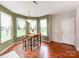Eat-in breakfast nook area with natural light and wood flooring at 11719 Withers Mill Dr, Charlotte, NC 28278