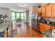 This kitchen features stainless steel appliances, wood cabinets, and a breakfast nook at 11719 Withers Mill Dr, Charlotte, NC 28278