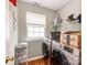 Efficient laundry room with modern washer and dryer, shelving, and a window for natural light at 11719 Withers Mill Dr, Charlotte, NC 28278