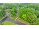 Aerial view of a charming home surrounded by lush trees at a street corner, highlighting location at 1287 Queensgate St, Gastonia, NC 28054