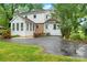 Charming backyard featuring a well-maintained lawn, mature trees and a two-story home at 1287 Queensgate St, Gastonia, NC 28054