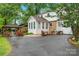 Spacious backyard with an elegant gazebo, well-manicured lawn, and beautiful flower beds at 1287 Queensgate St, Gastonia, NC 28054