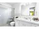 Bright bathroom featuring a glass-enclosed shower, vanity with a sink, and white tile at 1287 Queensgate St, Gastonia, NC 28054