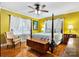 Comfortable bedroom features a four-poster bed, hardwood floors, and ample natural light at 1287 Queensgate St, Gastonia, NC 28054