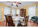 Cozy dining room featuring a wood table with seating for six, complemented by a decorative china cabinet at 1287 Queensgate St, Gastonia, NC 28054