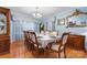 Formal dining room with ample seating, elegant chandelier, and traditional decor at 1287 Queensgate St, Gastonia, NC 28054