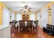 Bright dining area with large windows, elegant table setting, and hardwood floors at 1287 Queensgate St, Gastonia, NC 28054