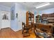 Spacious home office featuring hardwood floors and filled with built-in bookshelves and a desk at 1287 Queensgate St, Gastonia, NC 28054