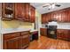 Well-equipped kitchen with wooden cabinetry, modern appliances, and ample counter space at 1287 Queensgate St, Gastonia, NC 28054