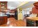 Spacious kitchen with wooden cabinetry, modern appliances, and bright yellow walls at 1287 Queensgate St, Gastonia, NC 28054