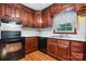 Functional kitchen featuring wood cabinets, modern appliances, and efficient layout at 1287 Queensgate St, Gastonia, NC 28054