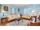 Elegant living room featuring classic furnishings, hardwood floors, and soft blue walls at 1287 Queensgate St, Gastonia, NC 28054