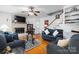 Cozy living area with fireplace, hardwood floors, and comfortable seating at 1287 Queensgate St, Gastonia, NC 28054