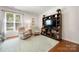 Comfortable bedroom with a large TV, bookcase, and cozy seating at 13216 Old Compton Ct, Pineville, NC 28134