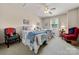 Charming bedroom with two twin beds, ceiling fan and a window view at 13216 Old Compton Ct, Pineville, NC 28134