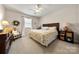 Comfortable bedroom with a ceiling fan and natural lighting at 13216 Old Compton Ct, Pineville, NC 28134