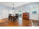 Dining room features wood table, and sliding glass door at 13216 Old Compton Ct, Pineville, NC 28134