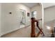 Hallway and stairwell with natural light leading to the bathroom and bedroom at 13216 Old Compton Ct, Pineville, NC 28134