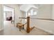 Inviting hallway with staircase and a comfortable bench seat at 13216 Old Compton Ct, Pineville, NC 28134