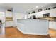 Kitchen featuring breakfast bar and white cabinets at 13216 Old Compton Ct, Pineville, NC 28134